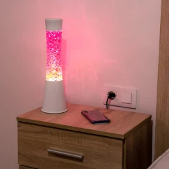 Lámpara de lava con purpurina de corazones con base blanca y líquido rosa