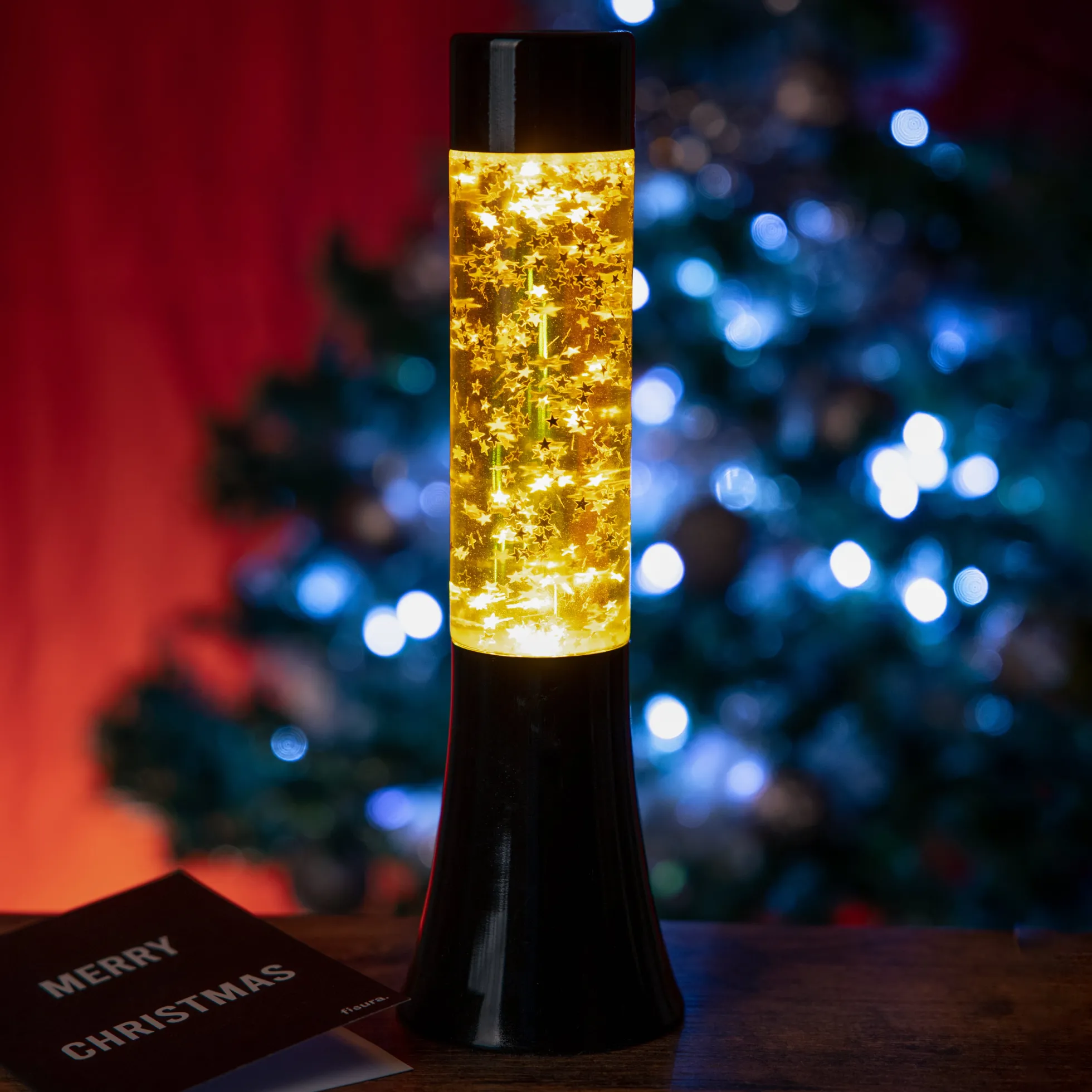 Lámpara de lava glitter de estrellas de 30 cm con base negra y líquido amarillo